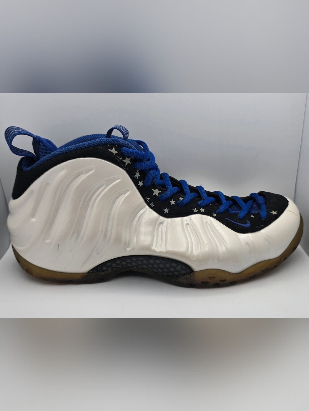 Nike Men’s Cream and Black Foamposite with Blue Accents